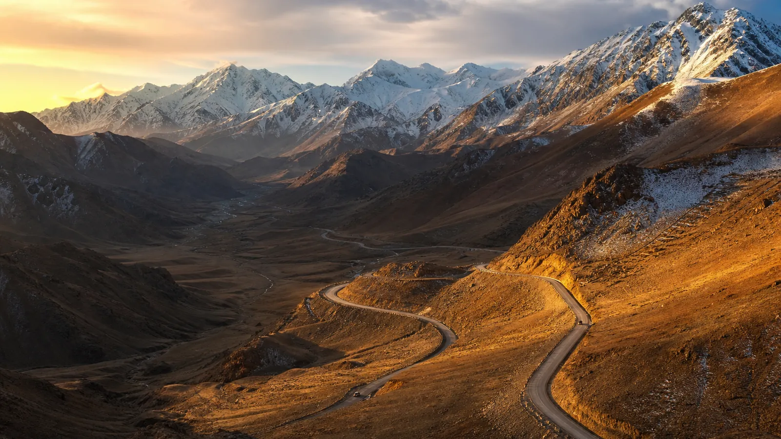 Hindu Kush mountains and a highway at sunrise in Afghanistan